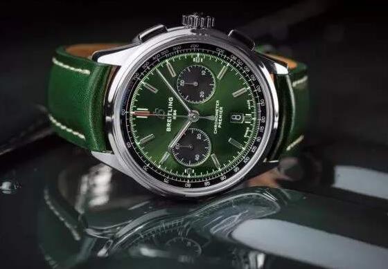 The black sub-dials are contrasted to the green dial.